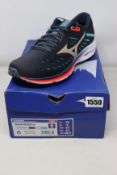 A pair of as new Mizuno Wave Rider 24 trainers (UK 9).
