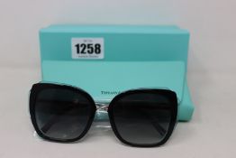 A pair of ladies boxed as new Tiffany & Co. Sunglasses (TF4160 82853C 54).