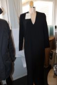 An as new Mark Kenly Domino Tan Demetra long V-neck dress with buttoning in black (Size 34).