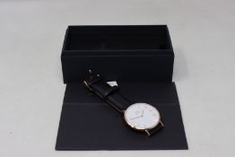 A boxed as new Daniel Wellington classic Sheffield watch white face and black leather strap (