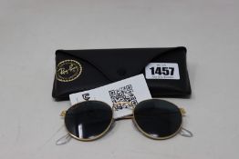 A pair of as new Ray Ban sunglasses.
