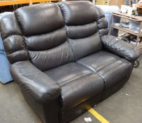 A two-seater black leather sofa.