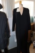 An as new Mark Kenly Domino Tan Demetra long V-neck dress with buttoning in black (Size 34).