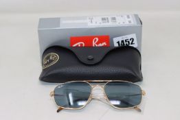 A pair of as new Ray Ban sunglasses.