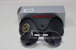 A pair of as new Ray Ban sunglasses.