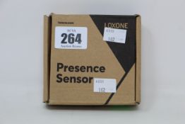 A boxed a new Loxone air presence sensor in White.