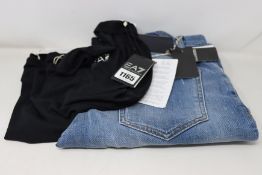 A pair of as new Emporio Armani jeans (Size 33) and an Emporio Armani T shirt (XL).