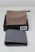 A boxed as new Bottega Veneta wallet in grey.
