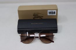 A pair of as new Burberry sunglasses.