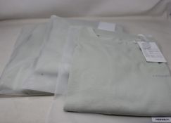 Three as new A.C.W. (A Cold Wall) Mod Lux short sleeve T-shirts in chalk (M).