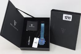 A boxed Paul Valentine blue mesh men's watch.
