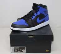 A pair of as new Nike Air Jordan 1 Mid (UK 9).