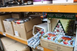 A quantity of Christmas and related items to include wrapping paper, Christmas cards, Disney