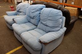 A blue two seater sofa together with an arm chair.