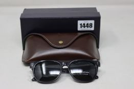A pair of as new Ralph Lauren sunglasses.