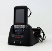 A pre-owned Honeywell Dolphin 60s Mobile Computer Barcode Scanner with cradle and power supply.