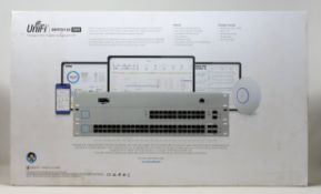 A boxed as new Ubiquiti US-24-250W 250W 24 Port PoE Switch (Outer sleeve of packaging damaged, box