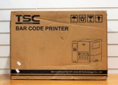 A boxed TSC MH340T Industrial Thermal Bar Code Printer (Appears as new. Box opened, some damage to