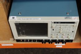 A pre-owned Tektronix TDS6124C Digital Storage Oscilloscope (Powers on, boots Windows XP and