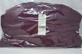 An as new Sweaty Betty Switch reversible puffa jacket in fig red (S - RRP £250).