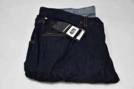 A pair of as new Emporio Armani five pocket jeans (34).