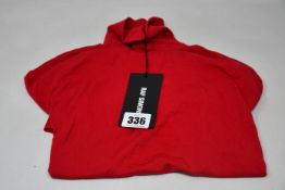 An as new Raf Simons polo neck in red (S - RRP £230).