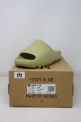 A pair of as new Adidas Yeezy Slide (UK 10).