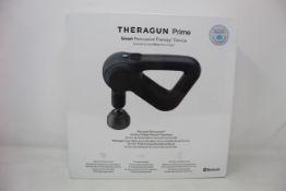 A boxed as new TheRagun Prime smart percussive therapy device.