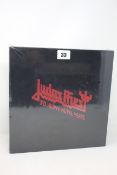 A Judas Preist 50 years of heavy metal red edition hardback book (Not sealed).
