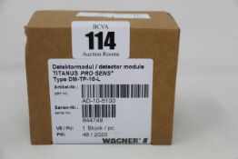 A boxed as new Wagner titanus pro-sens detector module (Type: DM-TP-10-L, Part no: AD-10-5100).
