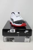 A pair of as new Nike Air Jordan 11 Retro Low (UK 6).