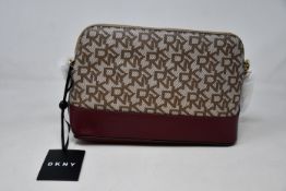 An as new DKNY Bryant logo shoulder bag.