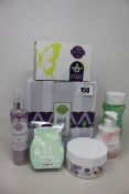 A quantity of as new Scentsy products to include three fragrance flowers; an etched core warmer