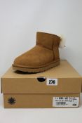 A pair of as new Ugg Classic mini Bow boots (UK 5).