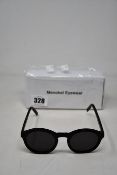 A pair of as new Monokel Moon sunglasses.