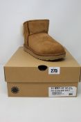A pair of as new Ugg Classic mini Bow boots (UK 4).