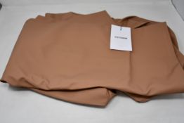 An as new Stutterheim Stockholm rain coat in sandalwood (L).