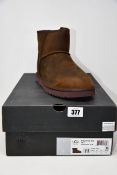 A pair of as new Ugg for Men Classic mini Deco boots (UK 10).