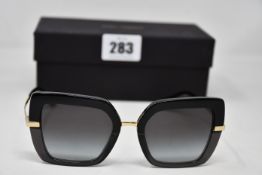 A pair of as new Dolce & Gabbana sunglasses.