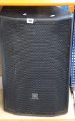 A pre-owned JBL PRX800 Series speaker.