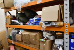 Two shelves of pet products and other related items.