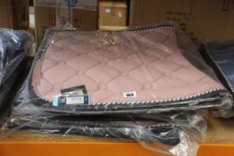 Four as new Dressage Saddle Pads from PS of Sweden in pink (Full size).