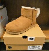 A pair of as new Ugg Classic mini Bow boots (UK 4).