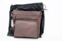 An as new Treats Ellie common natural chestnut leather bag with dust cover.