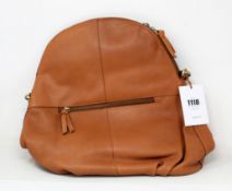 An as new Hannah Common natural tan leather back pack bag with dust cover.