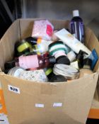 A box of Body Shop products to include shower gels, clay mask, creams and cleansing butters.