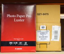 Twenty as new Canon photo paper Pro Luster (20 A4 per pack).