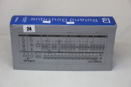 An as new Roland JU-06A sound module (Box has some slight damage).