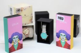 A ladies boxed as new Coluri Watch in turquoise with a spare strap.