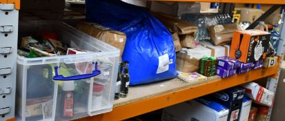 A shelf of food, drink and related items.